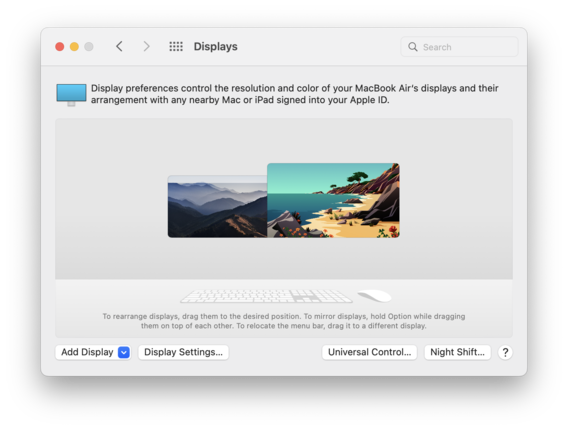A window of the "Displays" setting on MacOS. At the top of the window, it reads, "Display preference control the resolution and color of your MacBook Air's displays and their arrangement with any nearby Mac or iPad signed into your Apple ID." Now, in the middle of the window, it shows two screens side by side with different content.